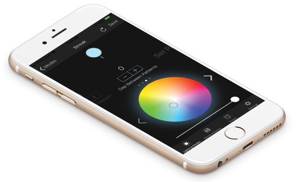 A smartphone displaying a lighting control app with a color wheel interface, allowing users to customize light colors and patterns.