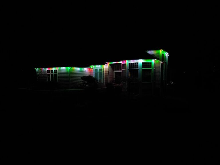 Oelo Holiday Lighting installation on a house with christmas color lights