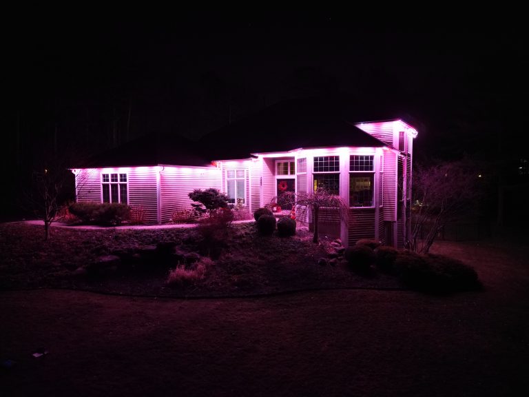 Oelo Holiday Lighting installation on a house with purple lights