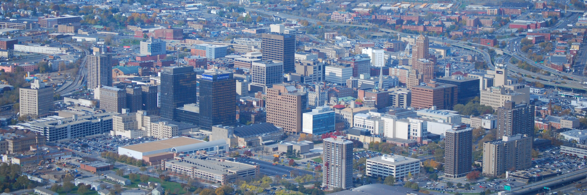 Downtown Syracuse, New York from helicopter. Onondaga Lake in background.